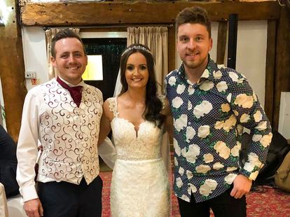 Tom Ryder with Danni and Stuart at their autumn wedding at Knebworth Barns