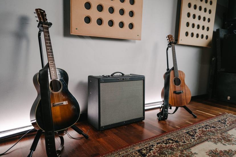 Two acoustic guitars and an amplifier.