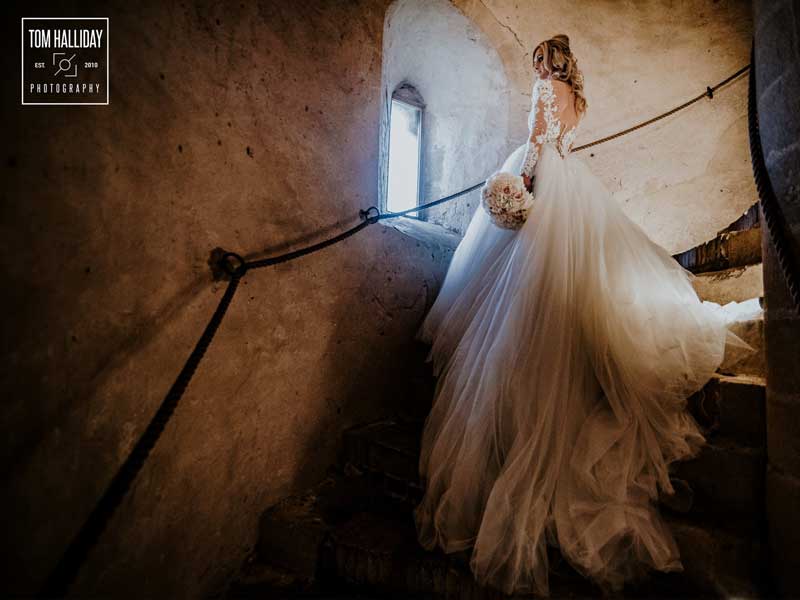 A stunning venue and dress makes for a beautiful composition